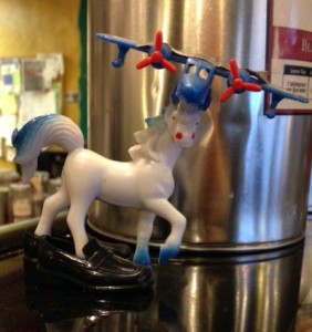 A toy horse with an airplane fixture, stands in Ken-doll plastic loafers. This sort of DIY assemblage has humor, weirdness, and possibilities that I like.